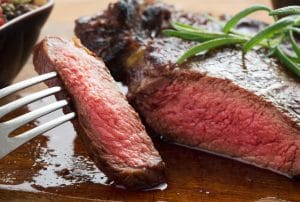 People with red meat allergy (alpha-gal) experience allergic symptoms from consuming red meat.