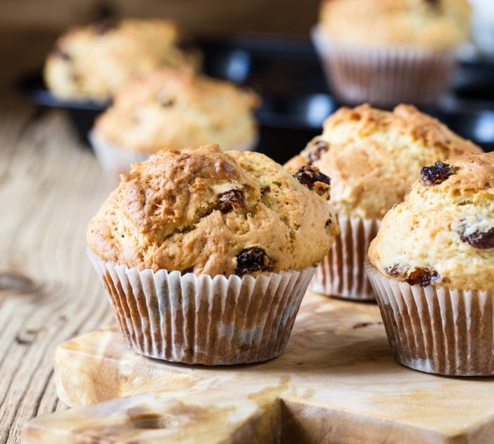 Breakfast cornmeal muffins with raisins, traditional american home baking.